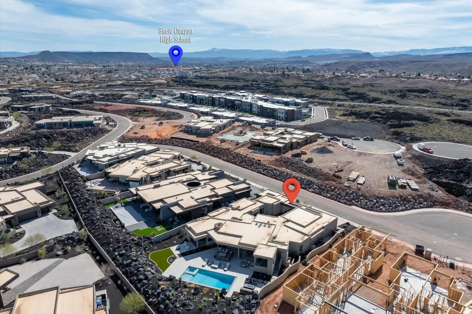 Aerial overview of property's location with a mountainous background