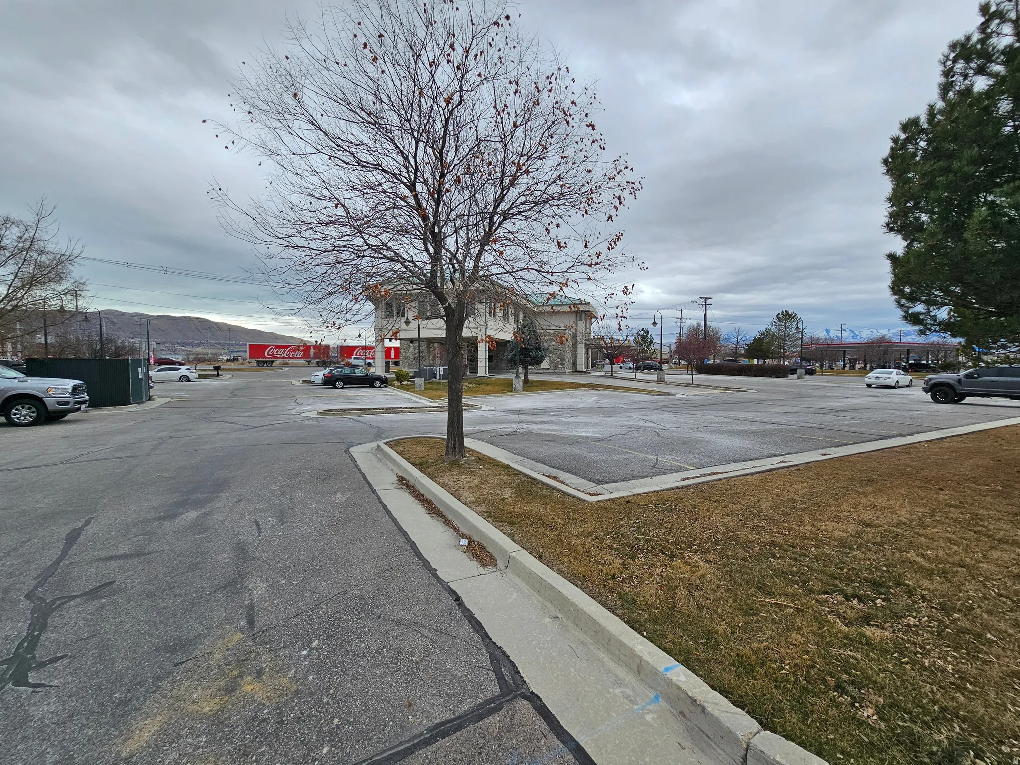 View of asphalt road with curbs