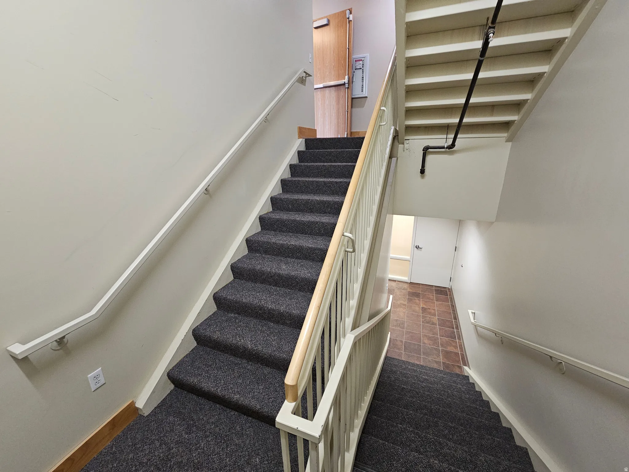 Stairway featuring baseboards