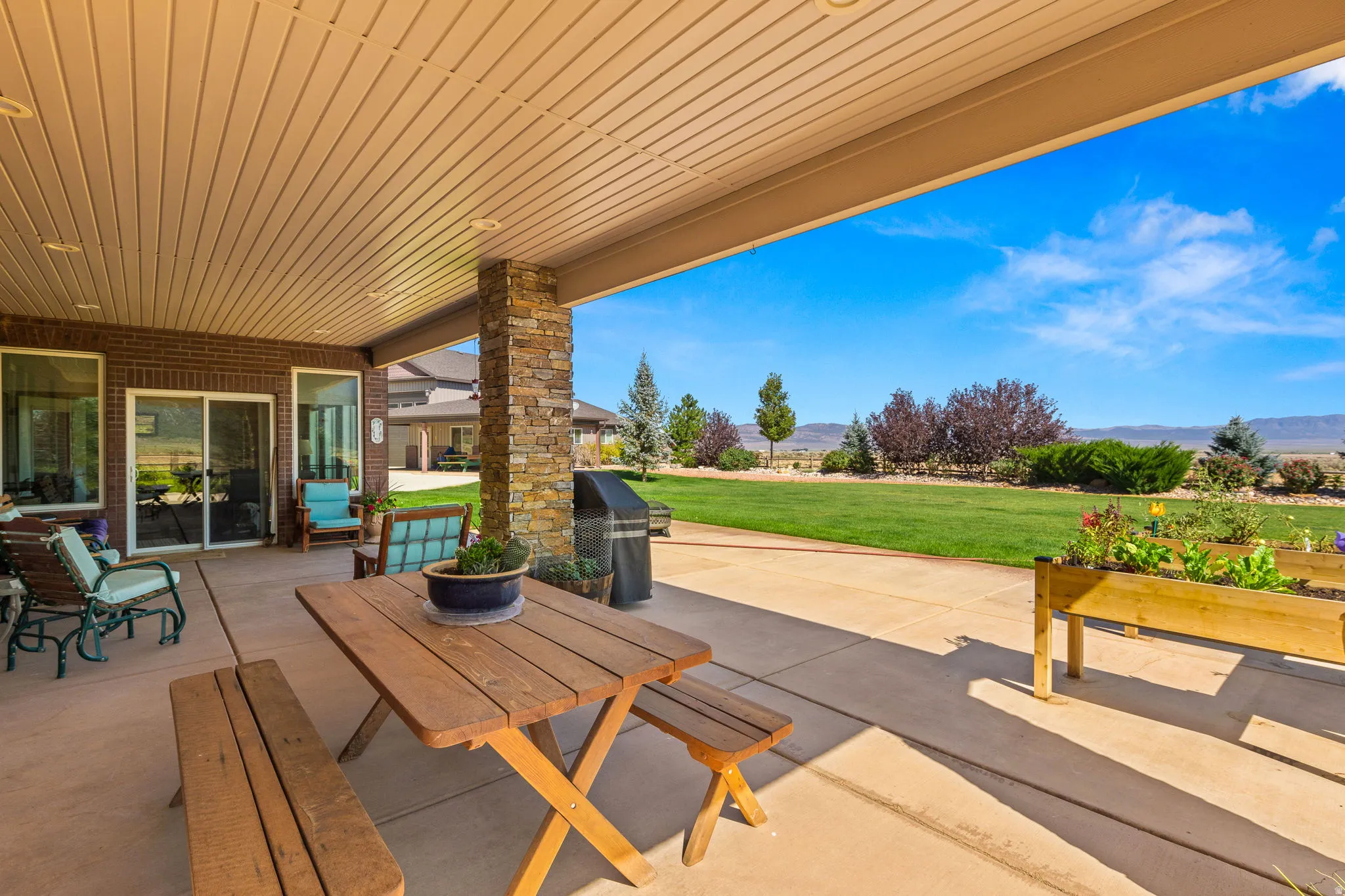 View of patio / terrace with a grill and a mountain view