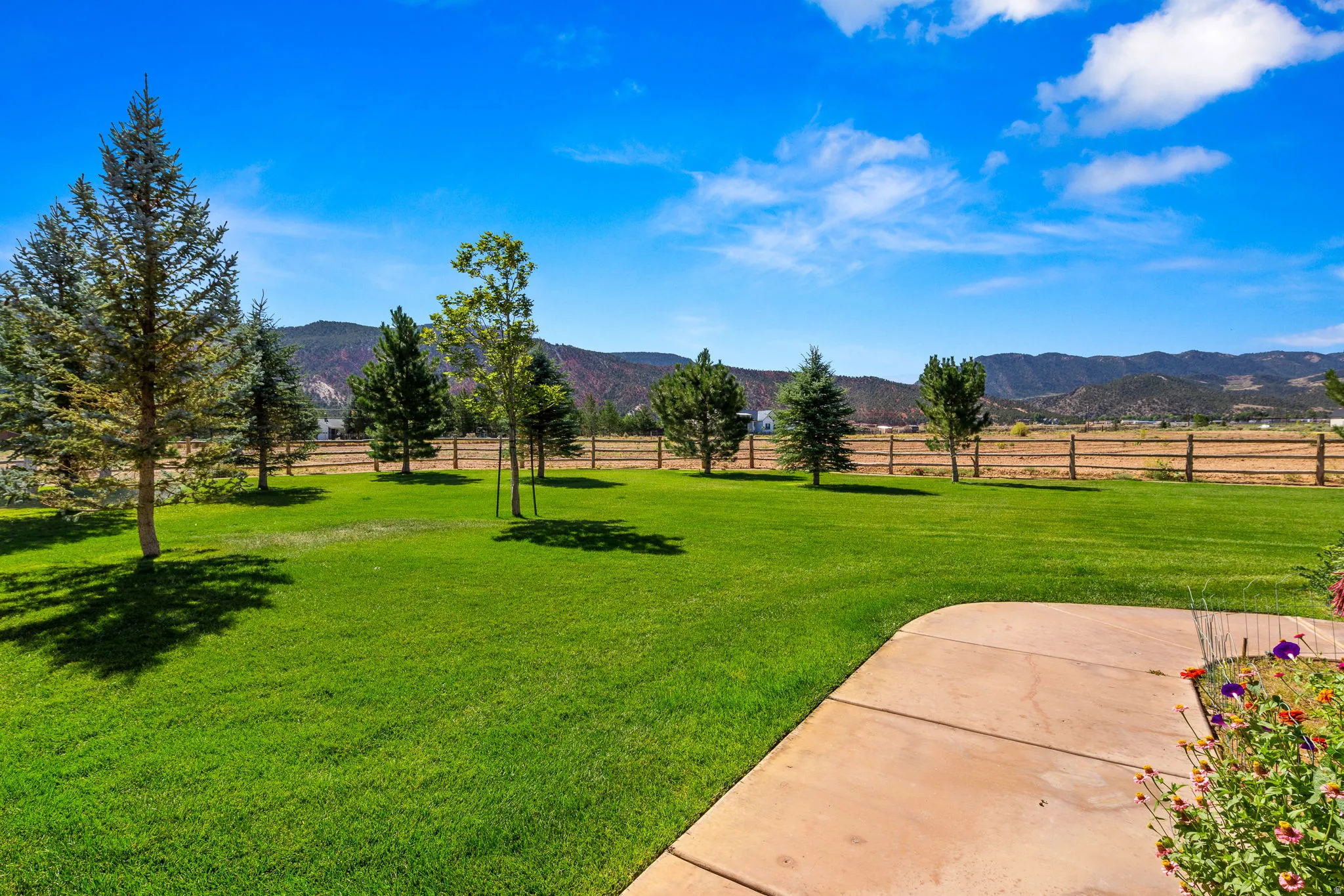 View of yard featuring a view of countryside and a mountain view