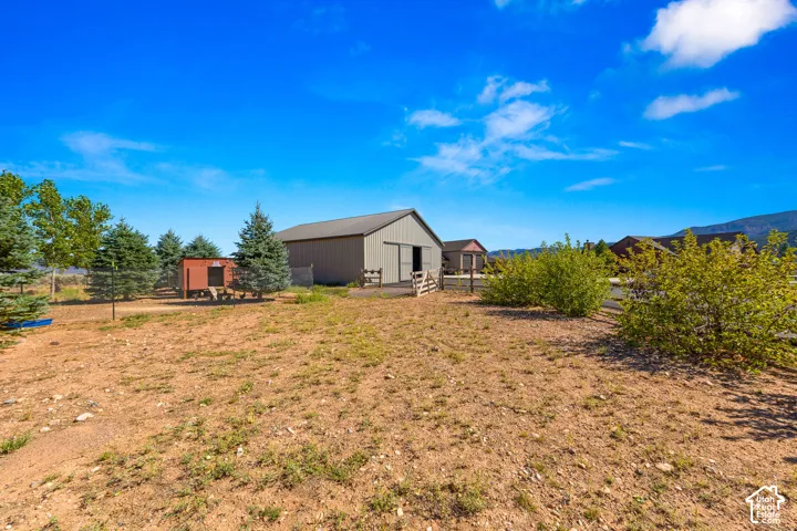 View of yard featuring an outbuilding and a mountain view