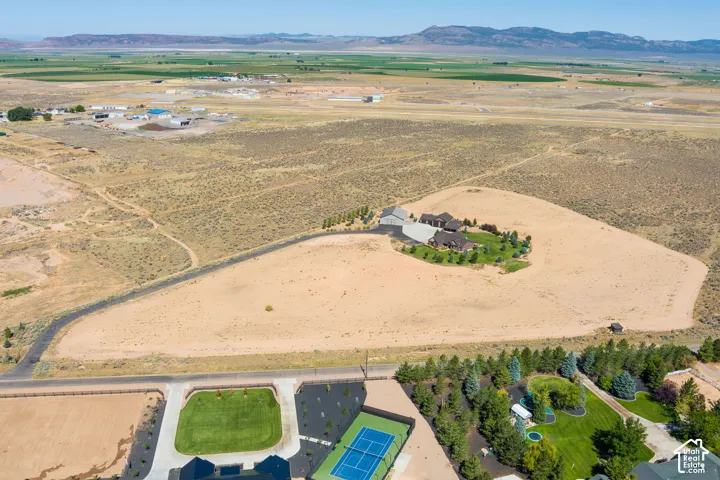 Aerial overview of property's location featuring rural landscape and a mountain backdrop