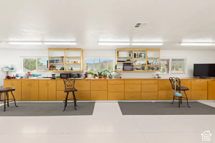 Kitchen with healthy amount of natural light and open shelves