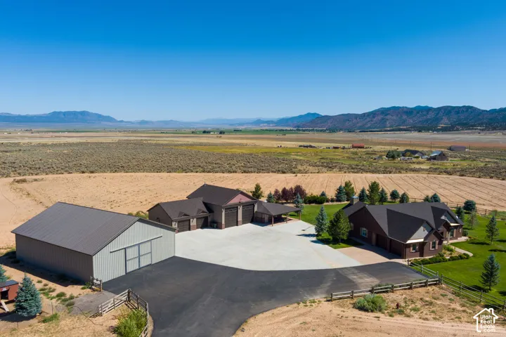 Aerial view of sparsely populated area featuring a mountain backdrop