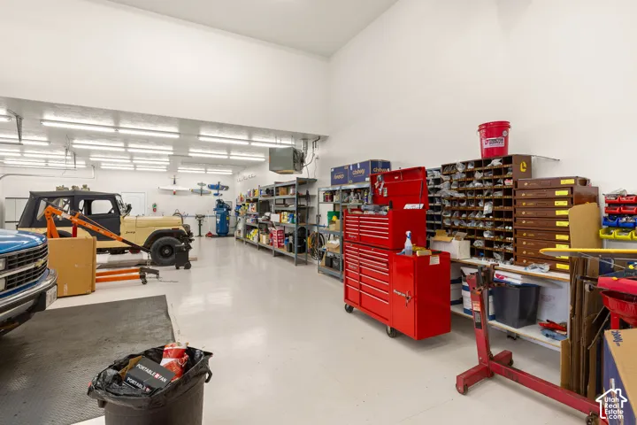 Garage with a heating unit and a workshop area