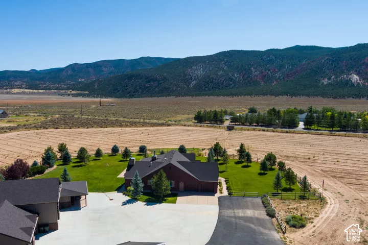 Overview of rural landscape featuring a mountain backdrop