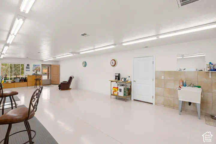 Garage featuring a sink