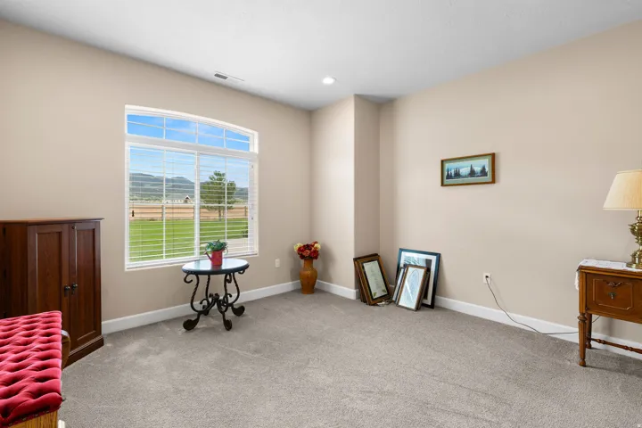 Miscellaneous room featuring light carpet and recessed lighting