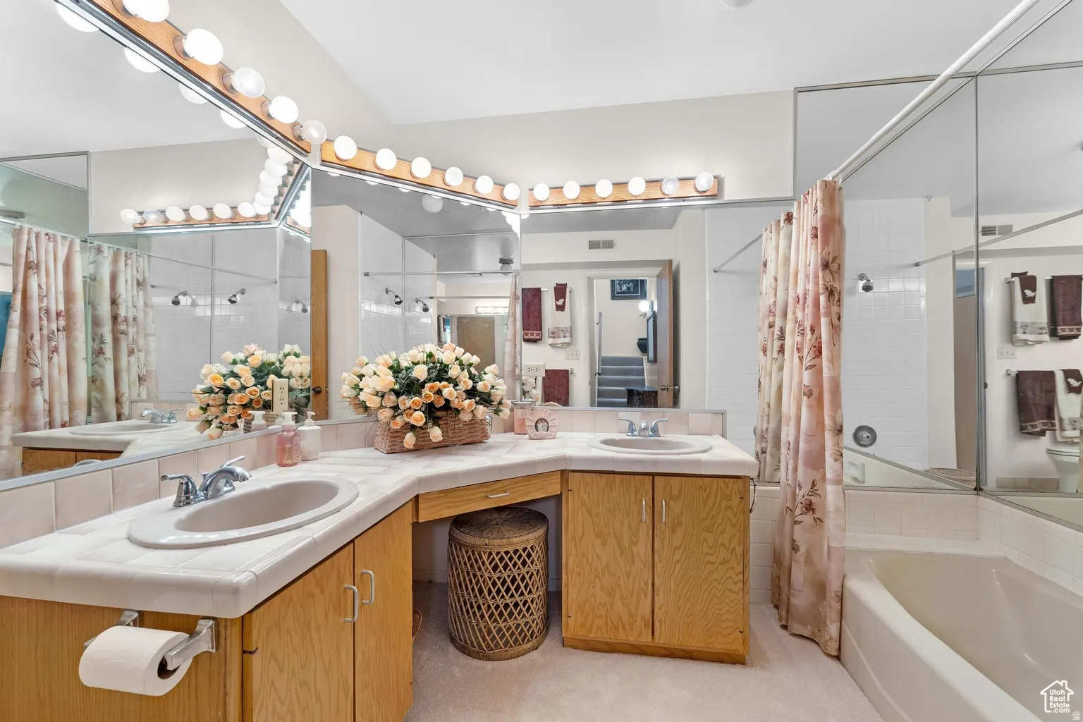 Primary Bathroom with a garden tub, double vanity, and a shower with shower curtain