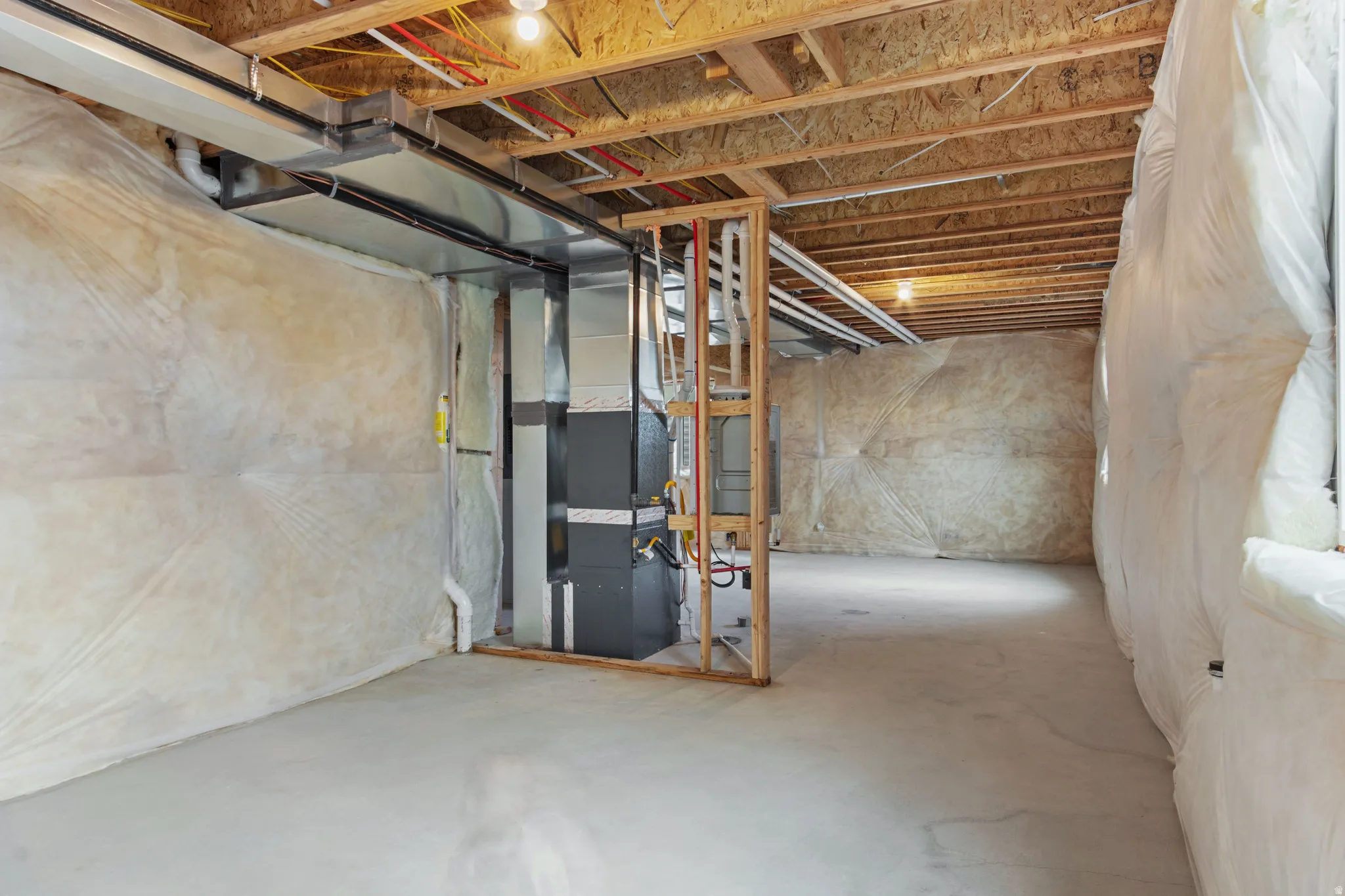 Unfinished below grade area with heating unit