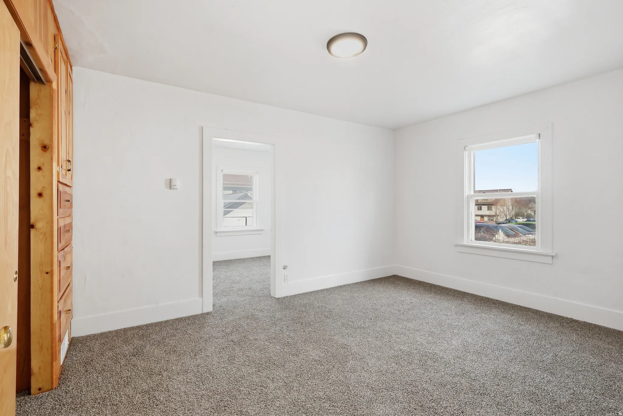Spare room with carpet floors and plenty of natural light