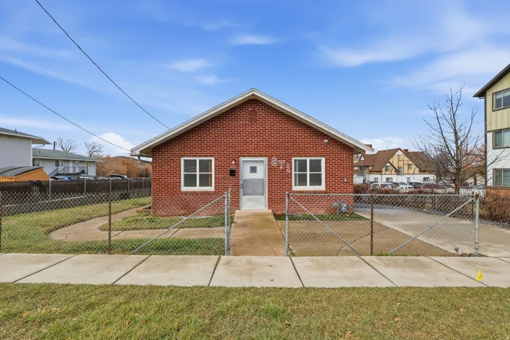 Bungalow-style home featuring brick siding