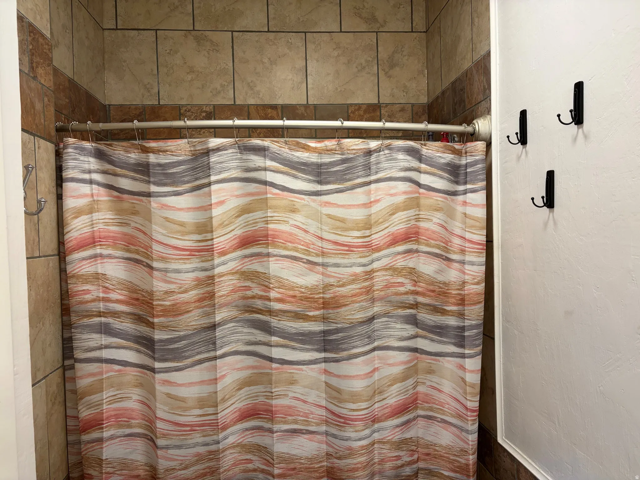 Full bath with a shower with shower curtain