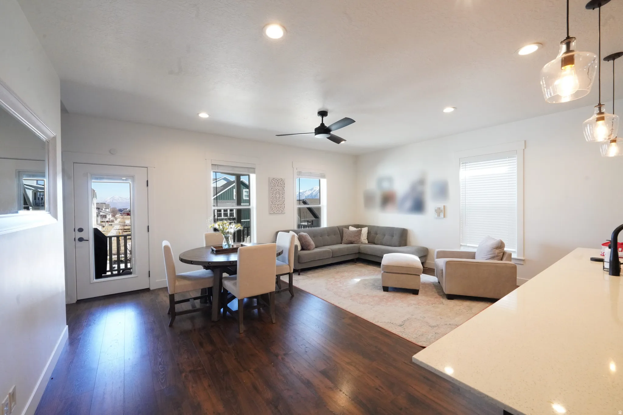 Dining room featuring dark wood finished floors, ceiling fan, and recessed lighting