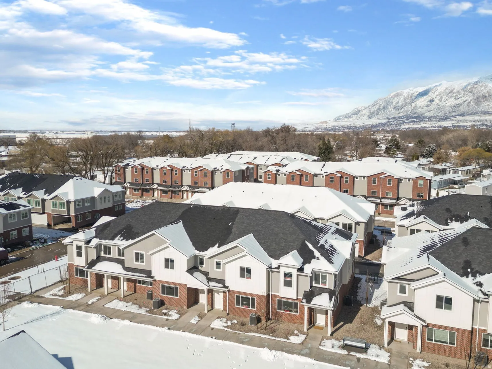 Snowy aerial view with a residential view