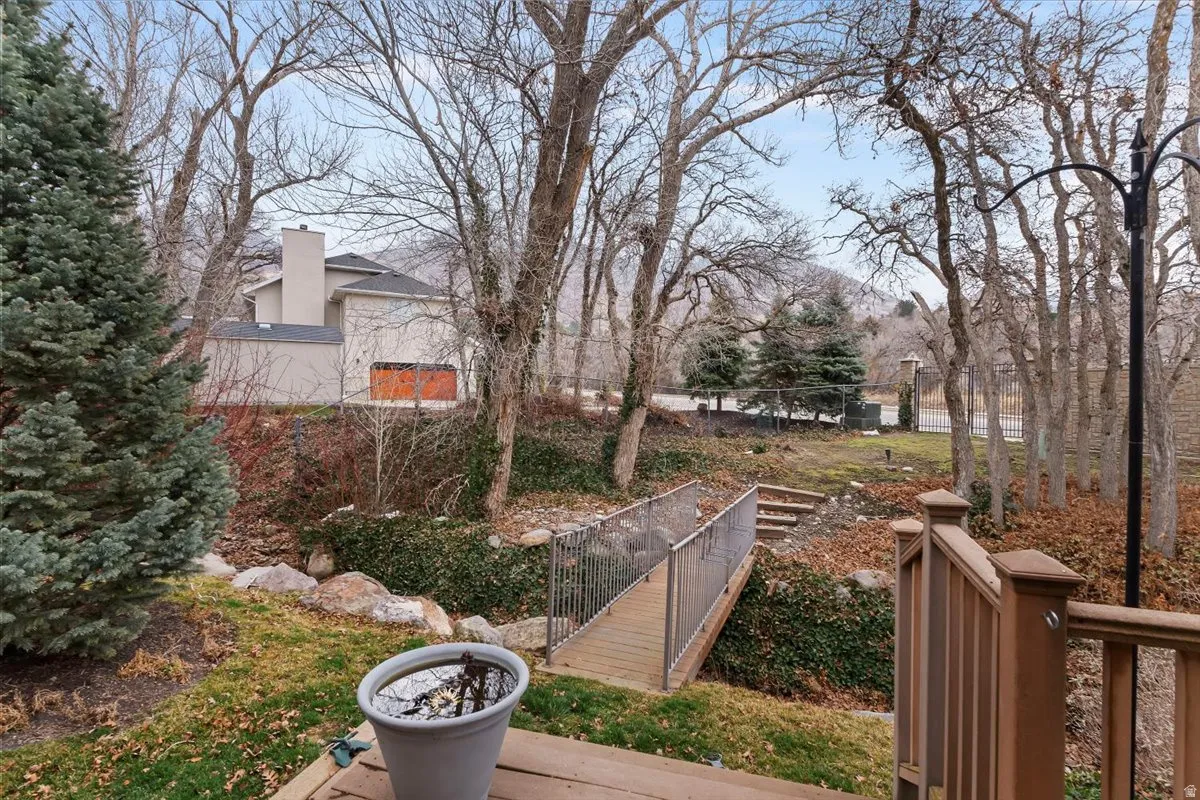 View of yard with a wooden deck
