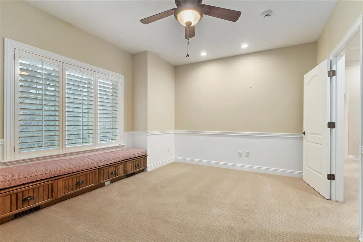 Unfurnished room featuring light colored carpet, ceiling fan, and recessed lighting