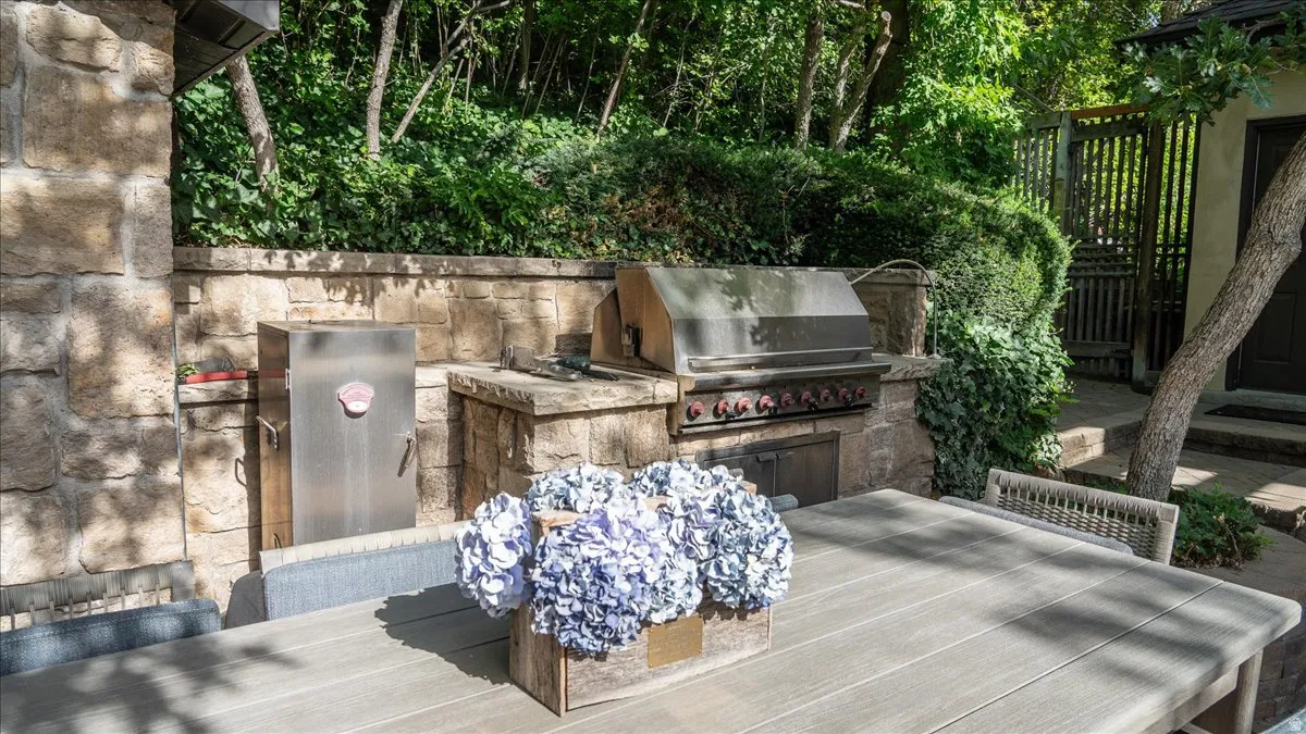 View of patio / terrace with an outdoor kitchen / dining area and a wooden deck