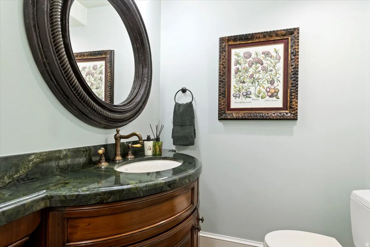 Bathroom featuring vanity and toilet