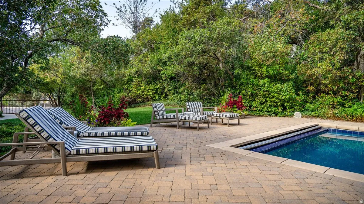 Outdoor pool featuring a patio