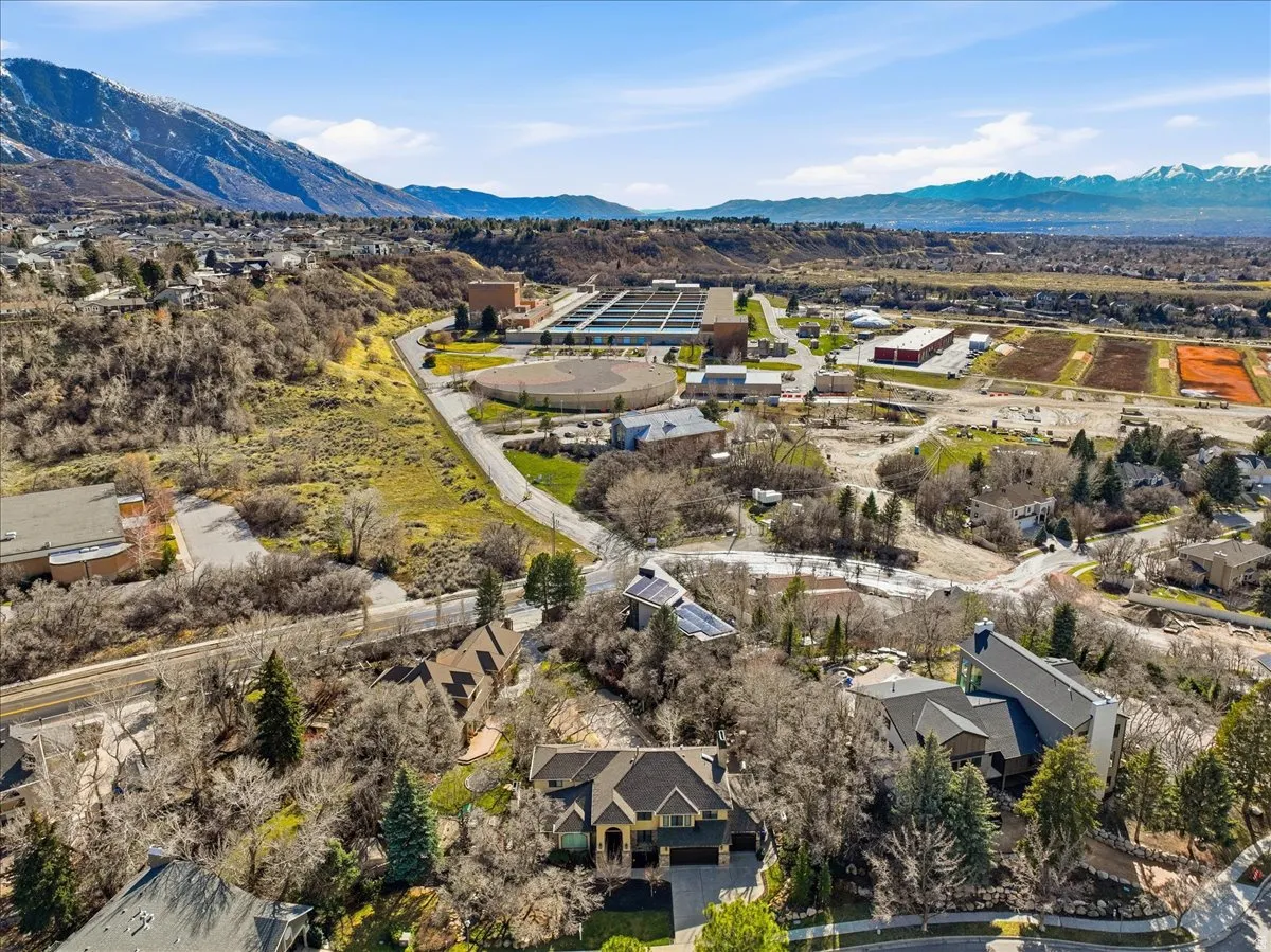 Aerial perspective of suburban area featuring a mountainous background