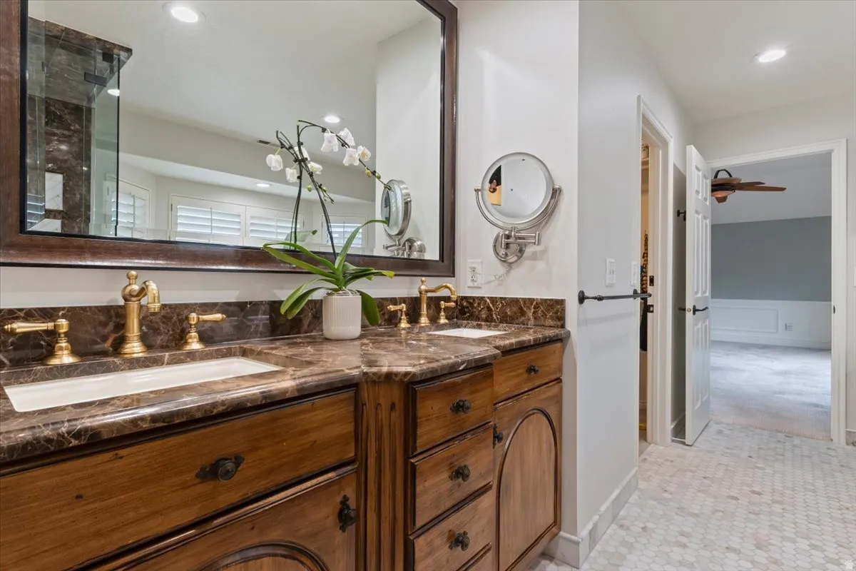 Bathroom with double vanity and recessed lighting