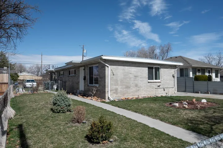 View of property exterior featuring brick siding