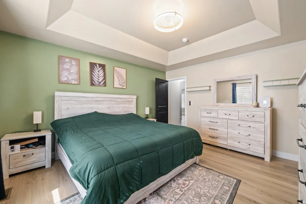 Tray ceiling accentuates the bedroom space