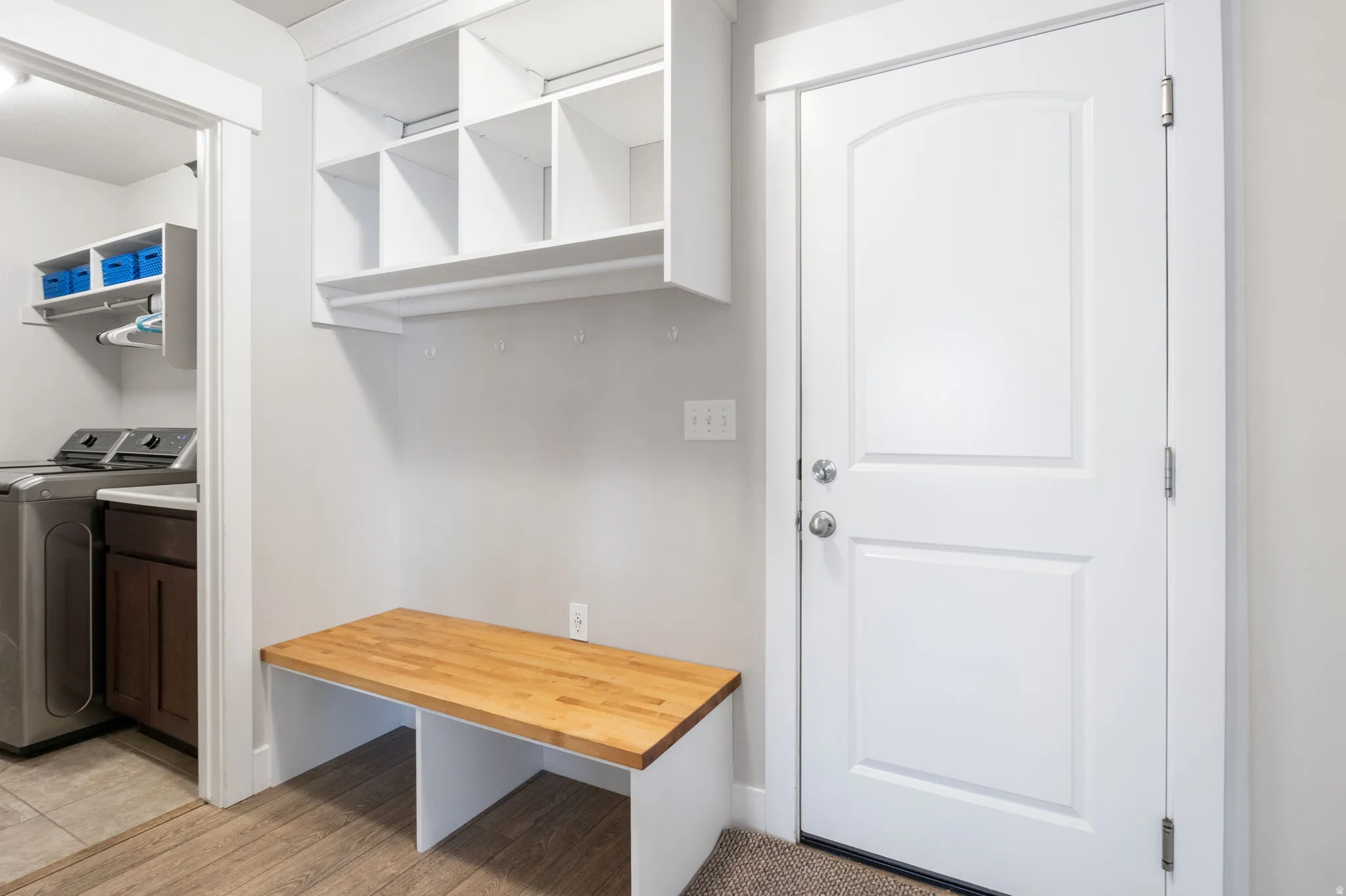 Mudroom with light wood-style floors