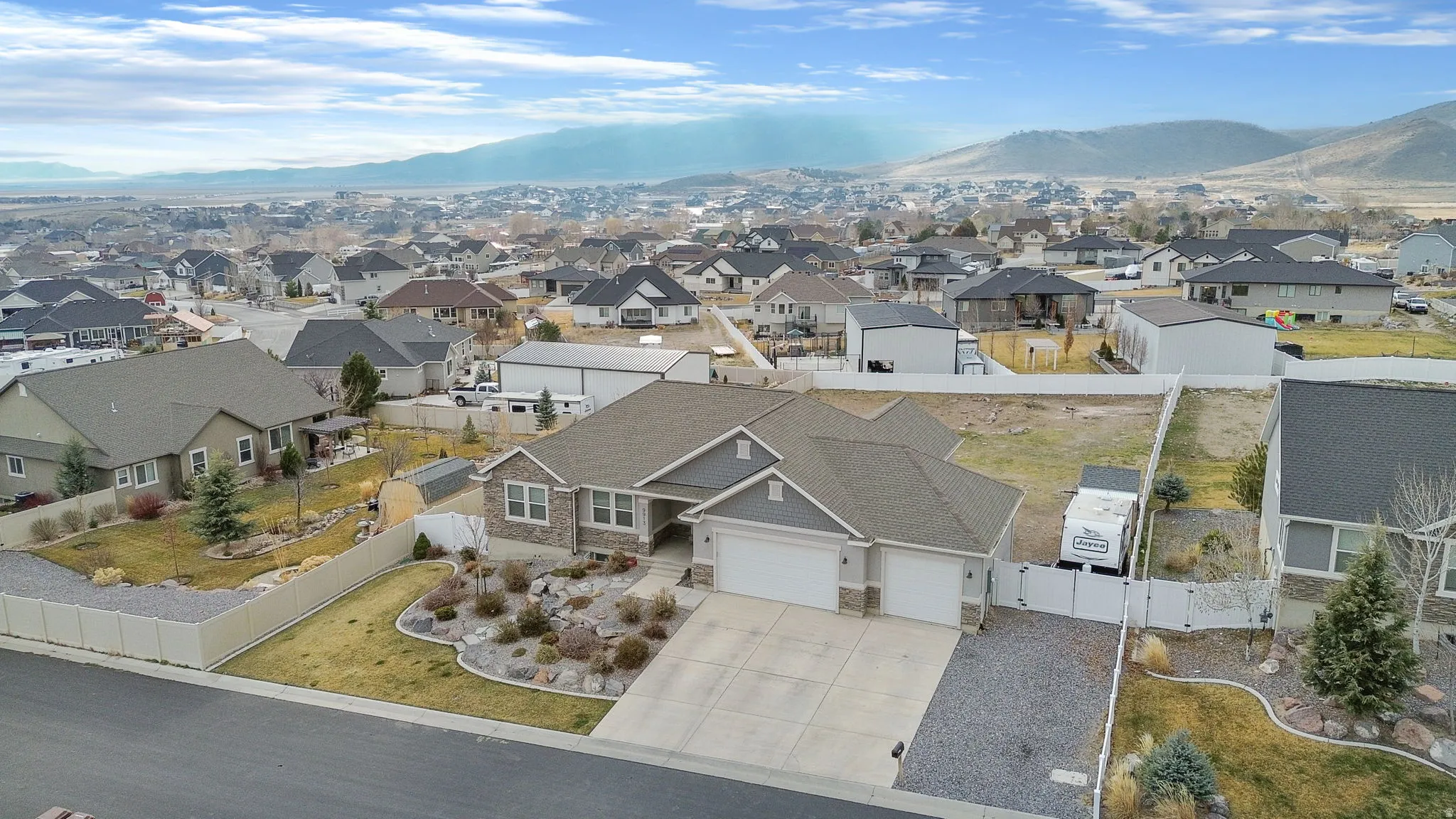 Aerial view of residential area featuring a mountain backdrop