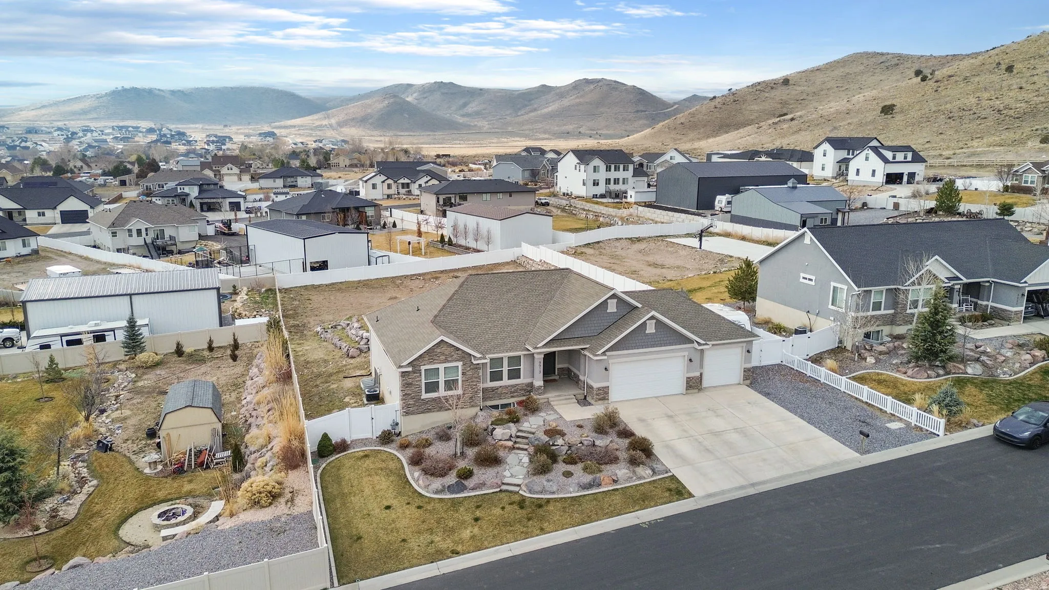 Aerial view of residential area featuring a mountainous background