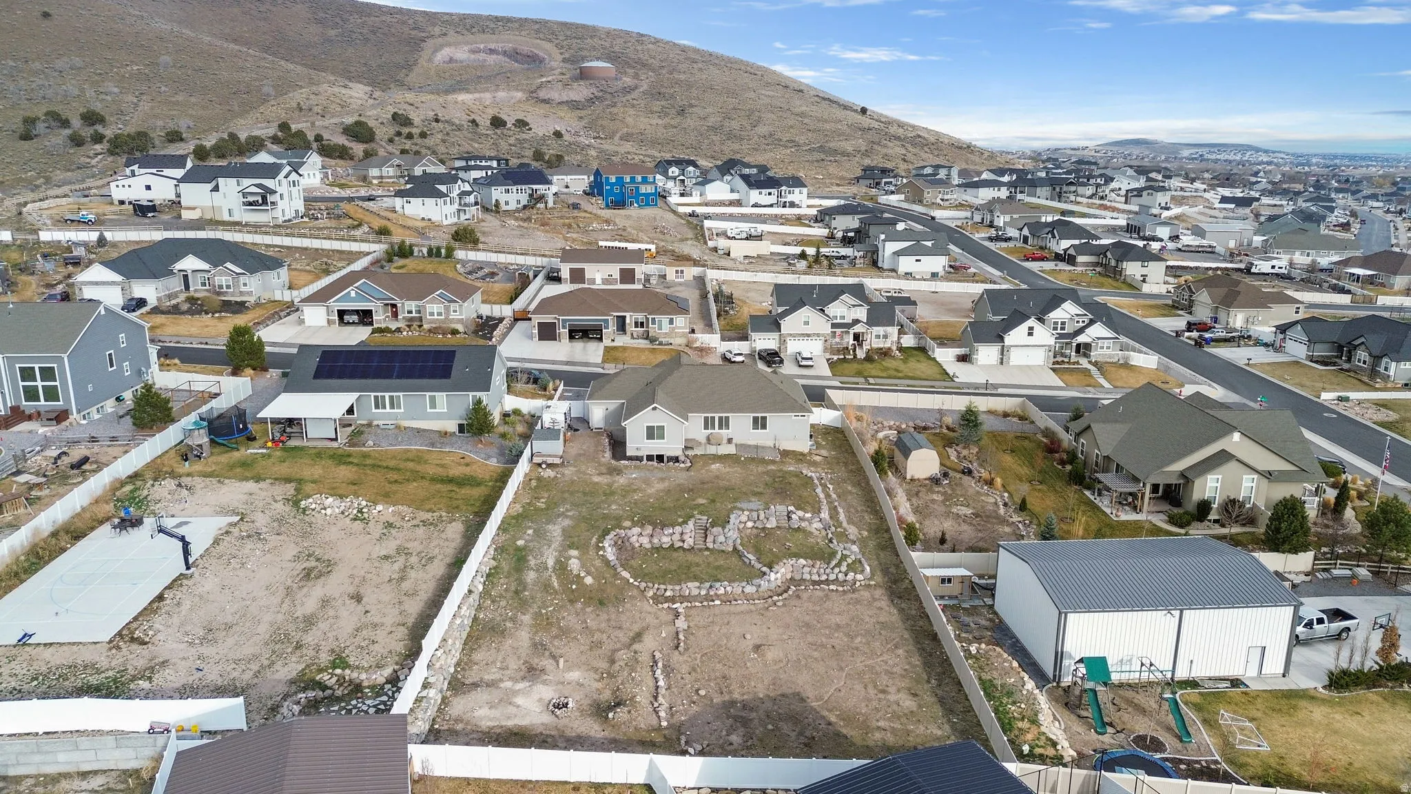 View of property location featuring mountains and nearby suburban area