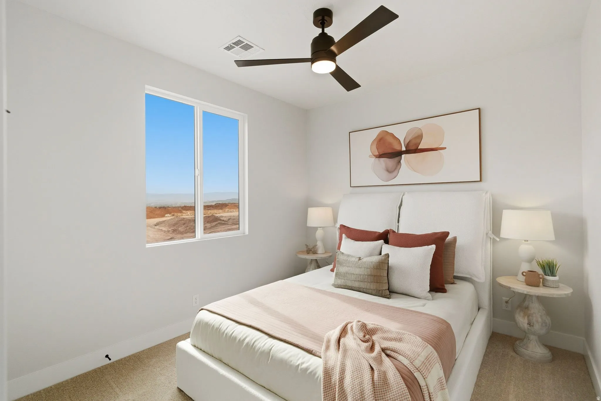 Bedroom with light colored carpet and ceiling fan