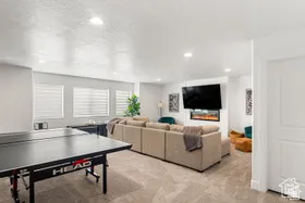 Playroom with light carpet and recessed lighting