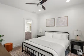 Bedroom featuring ensuite bath, a ceiling fan, and recessed lighting