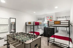 Bedroom featuring light colored carpet and recessed lighting