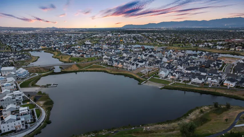 Aerial view at dusk of a residential view and a water and mountain view