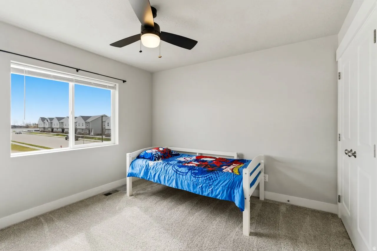 Large bedroom with ceiling fan