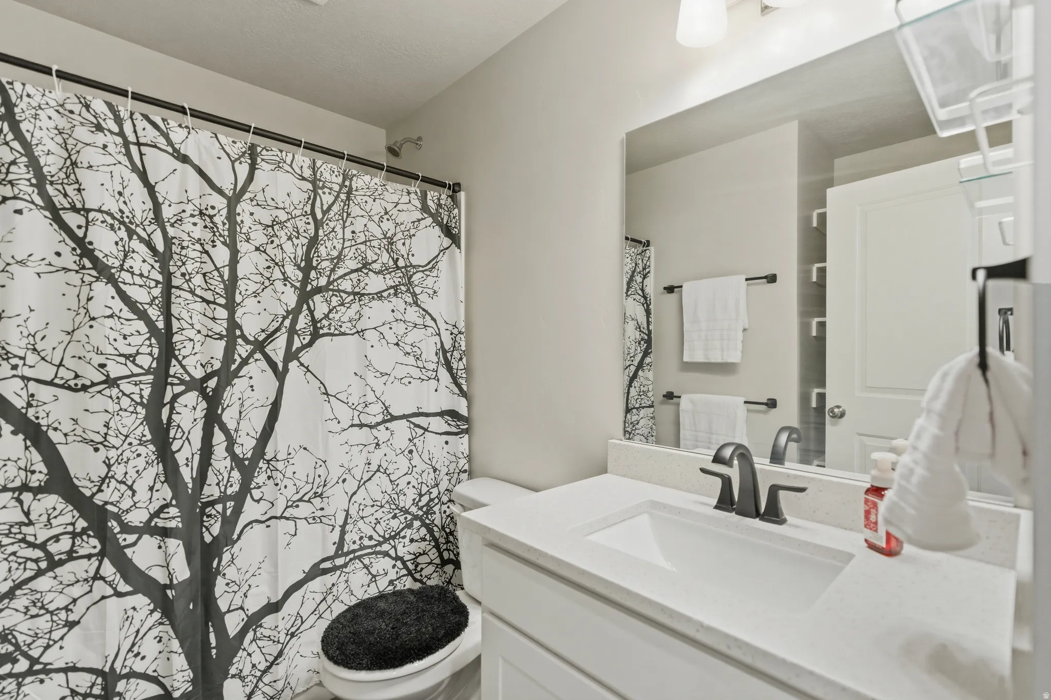 Full bathroom featuring vanity and tub/shower combo