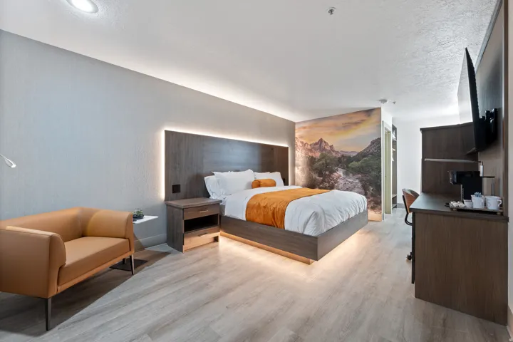 Bedroom with light wood finished floors and baseboards