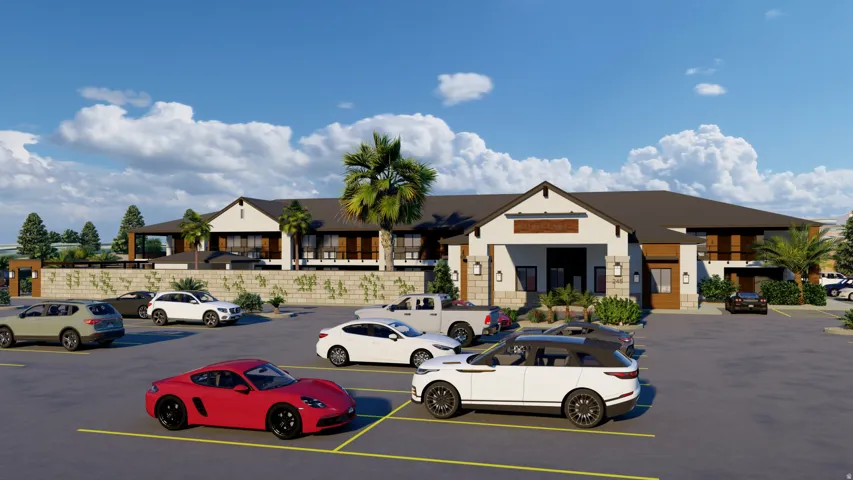 View of property featuring uncovered parking