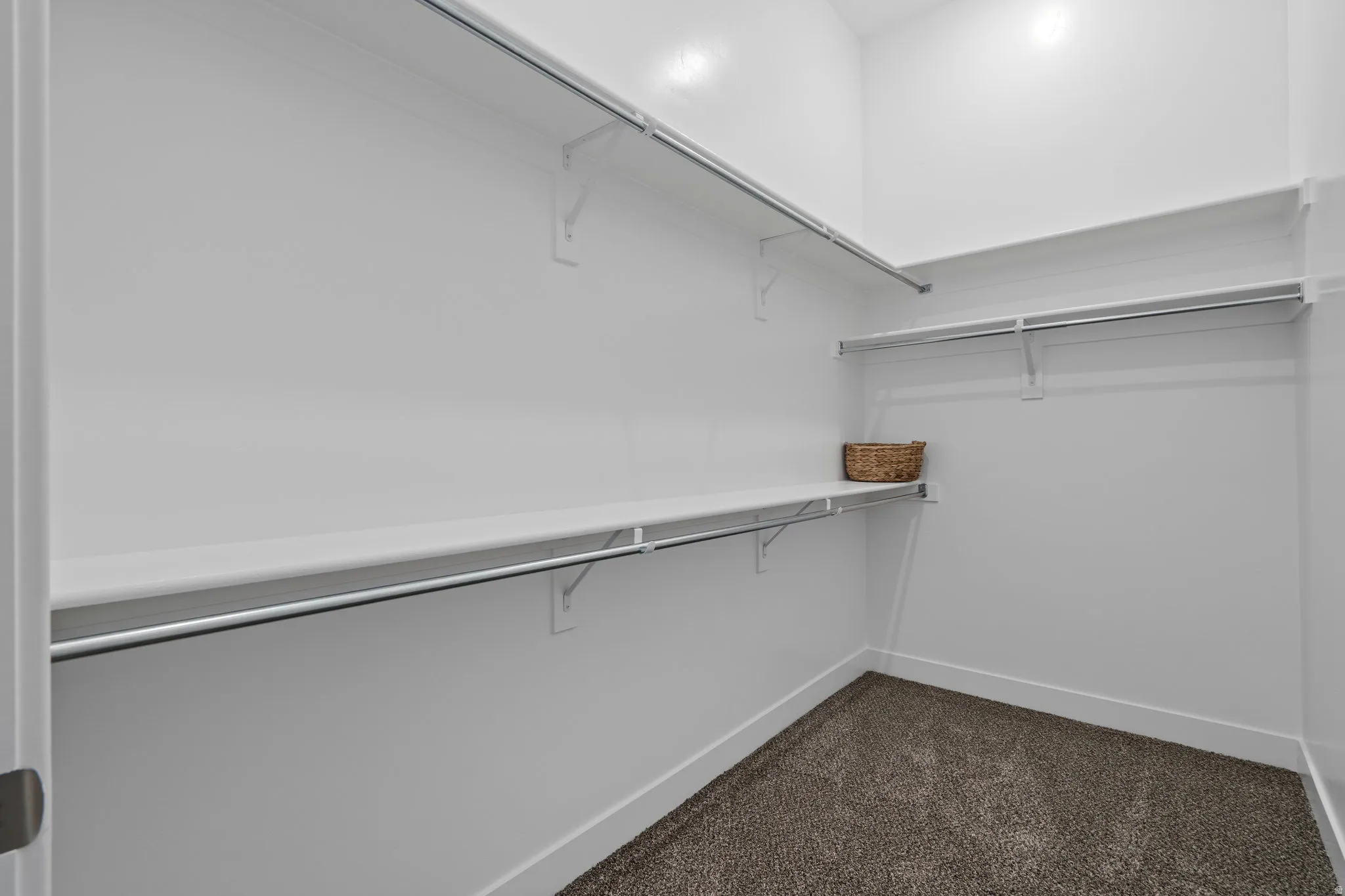 Primary bedroom walk in closet.