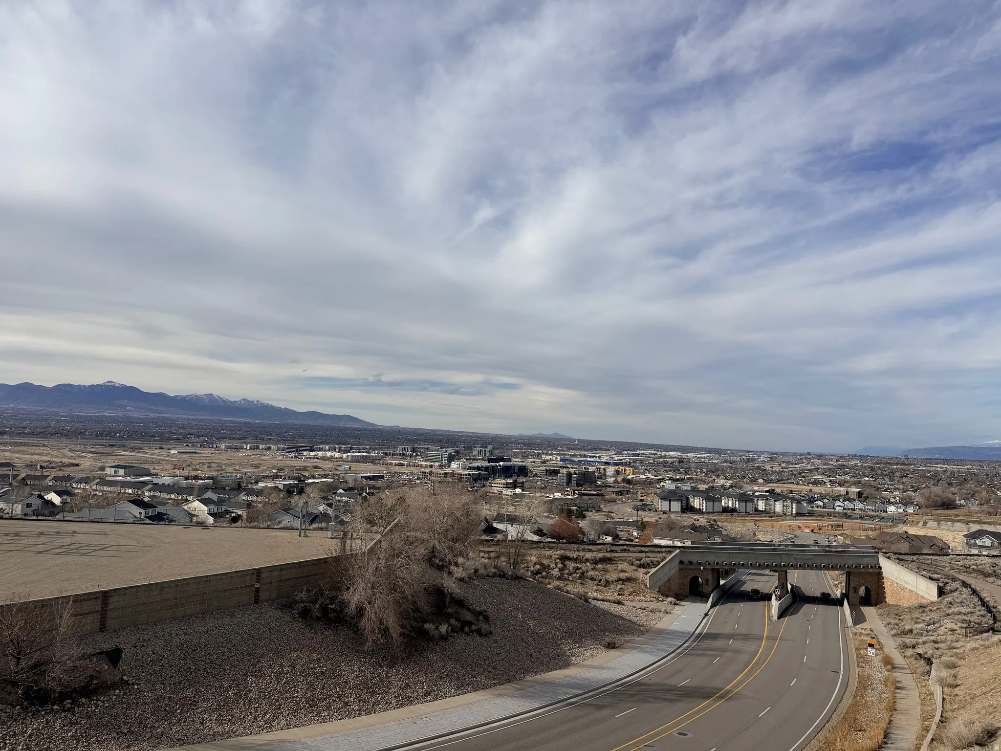 Aerial perspective of suburban area featuring a mountainous background