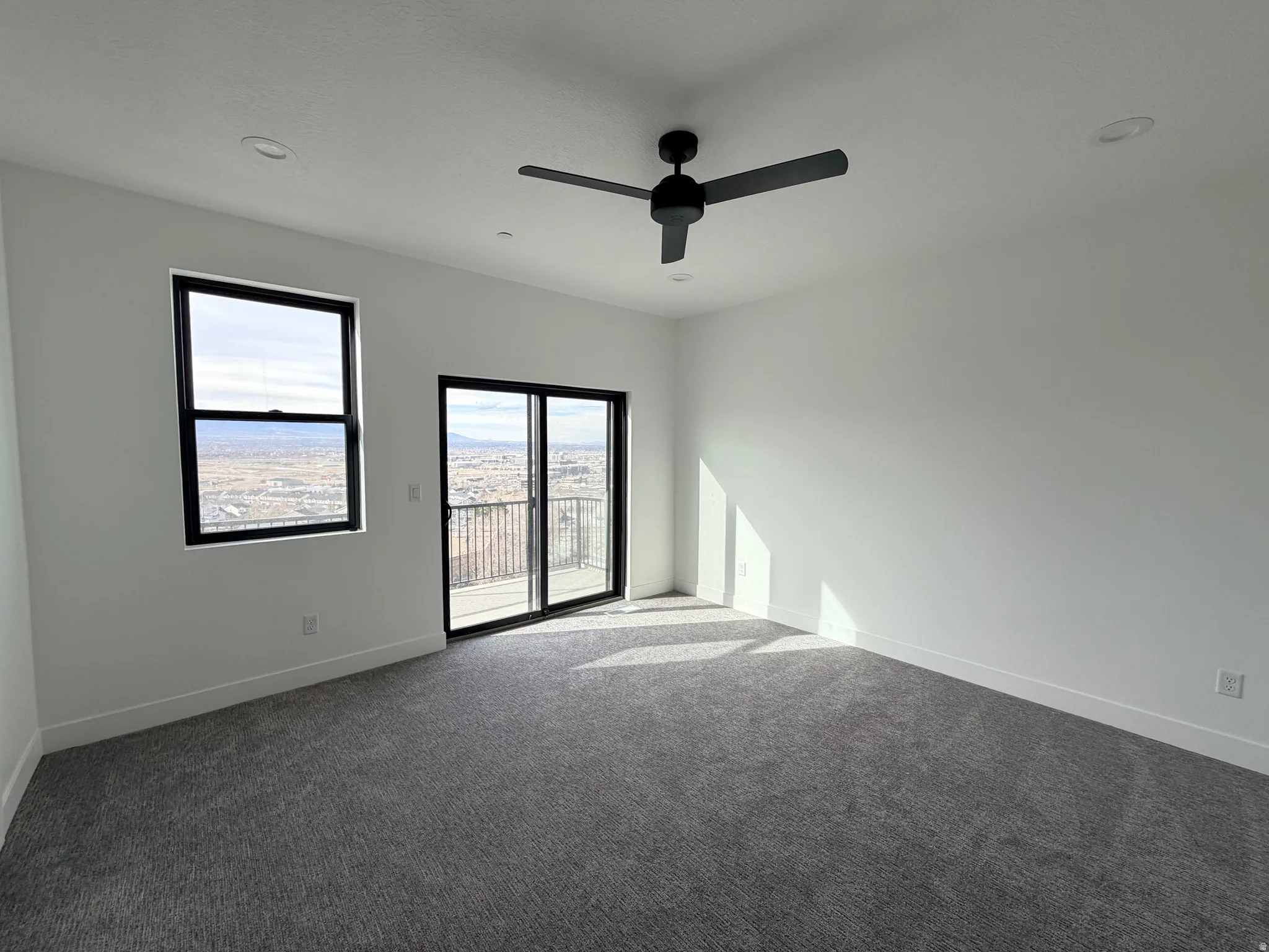 Bedroom with carpet, ceiling fan, and recessed lighting
