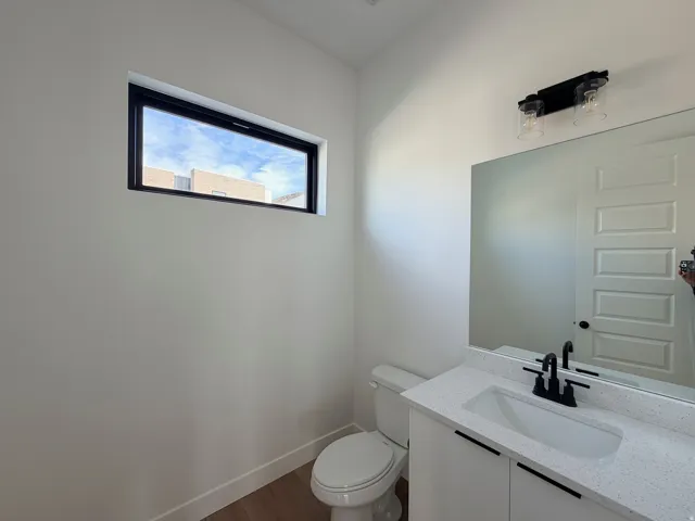 Bathroom with vanity and dark wood finished floors