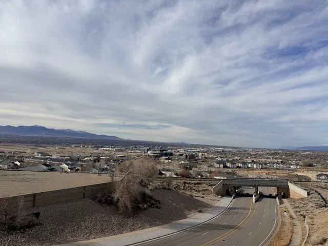 Aerial perspective of suburban area featuring a mountainous background