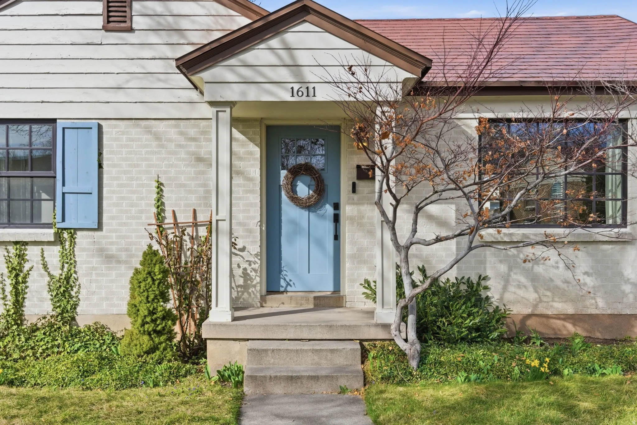 Doorway to property with brick siding