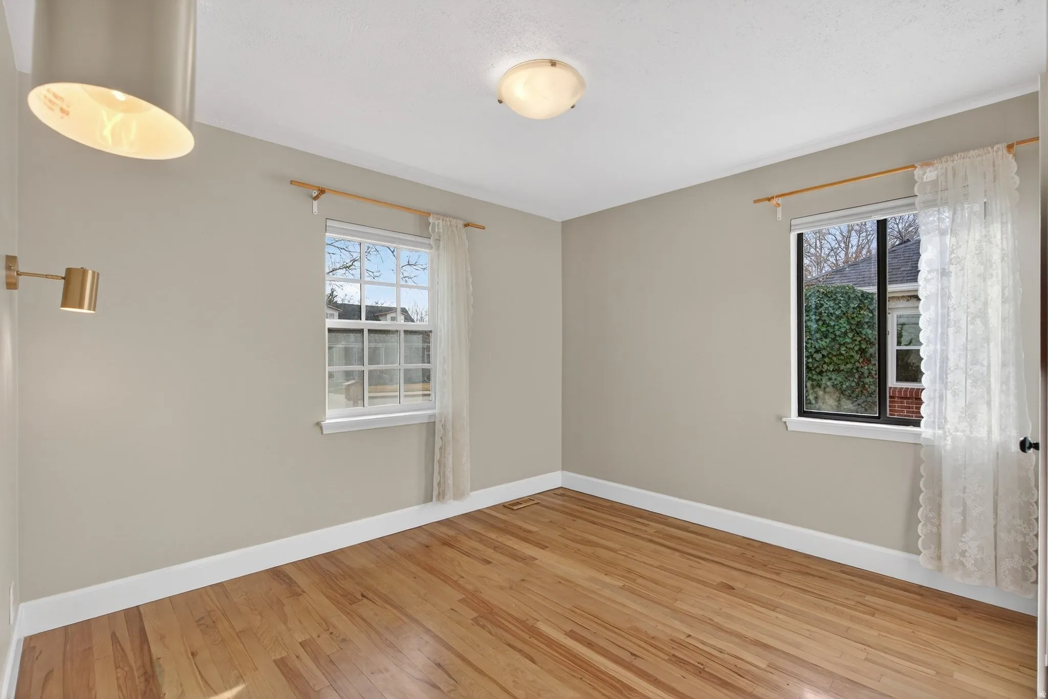 Empty room featuring light wood-style floors and baseboards