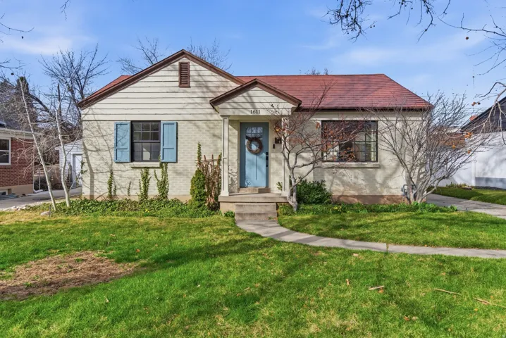 Bungalow-style home featuring a front yard